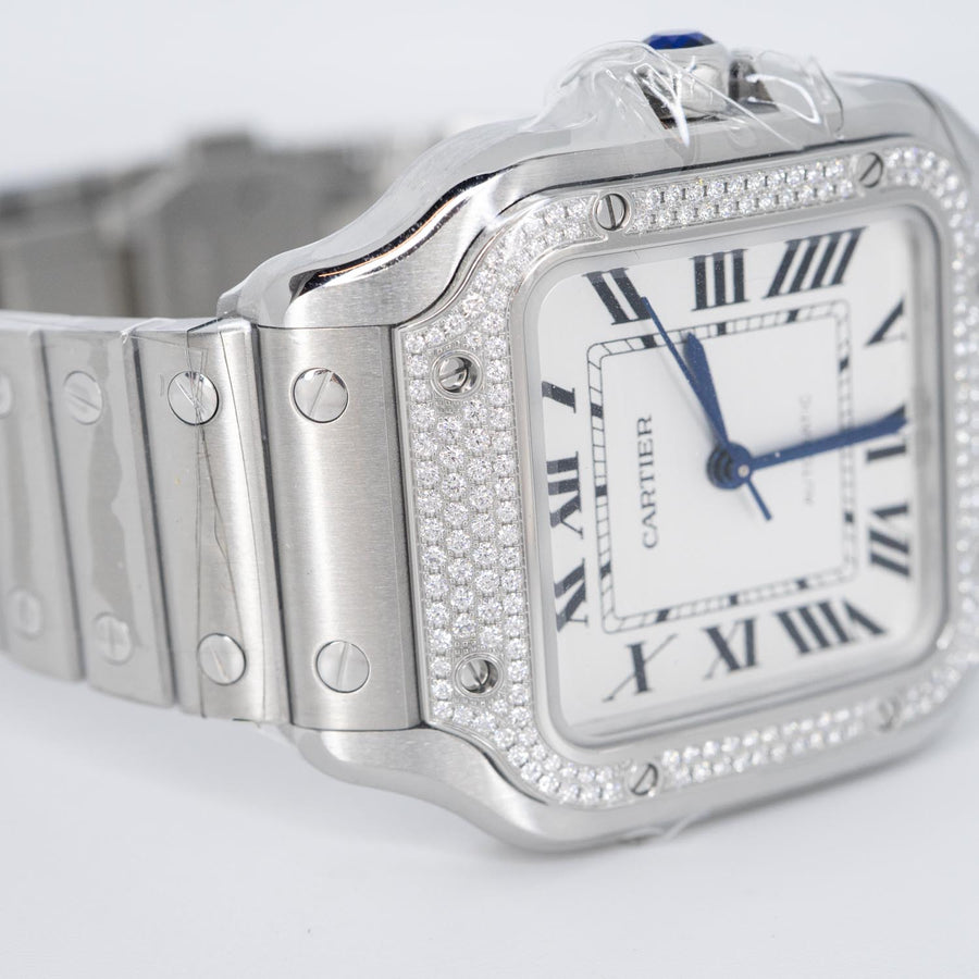 นาฬิกา Cartier Santos watch, medium model, mechanical movement with automatic winding, caliber 1847 MC. Steel case, steel bezel set with 206 brilliant-cut diamonds totaling 0.64 carats Stainless Steel Size M# (Used) #vrca 0957