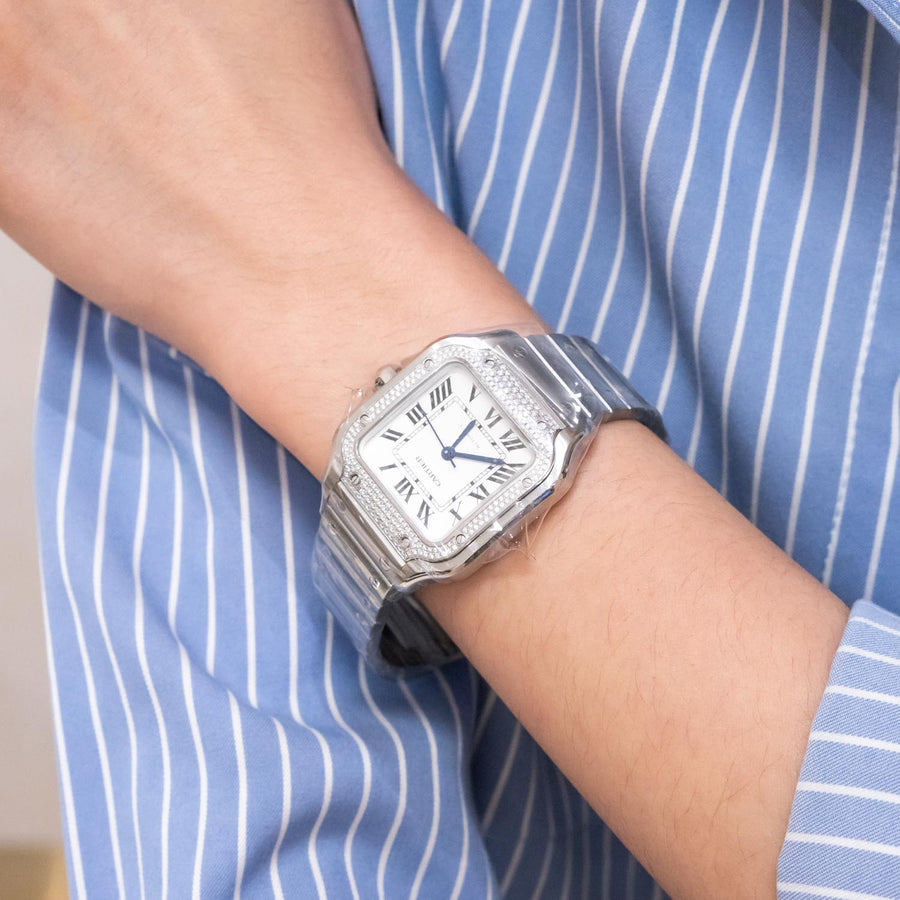 นาฬิกา Cartier Santos watch, medium model, mechanical movement with automatic winding, caliber 1847 MC. Steel case, steel bezel set with 206 brilliant-cut diamonds totaling 0.64 carats Stainless Steel Size M# (Used) #vrca 0957
